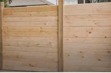 Wooden fence with horizontal timber panels