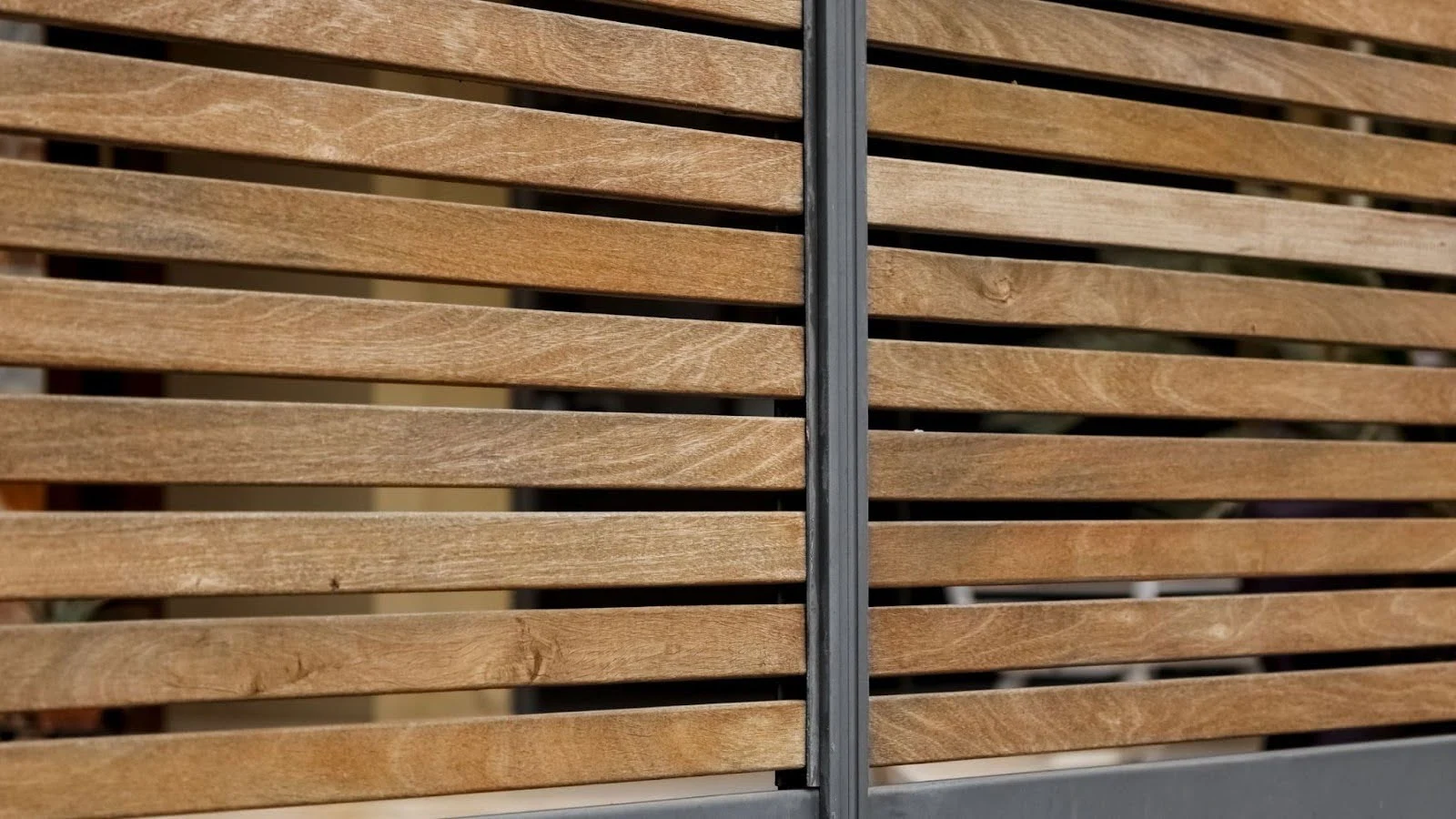 Close-up of a modern timber slat fence with even spacing
