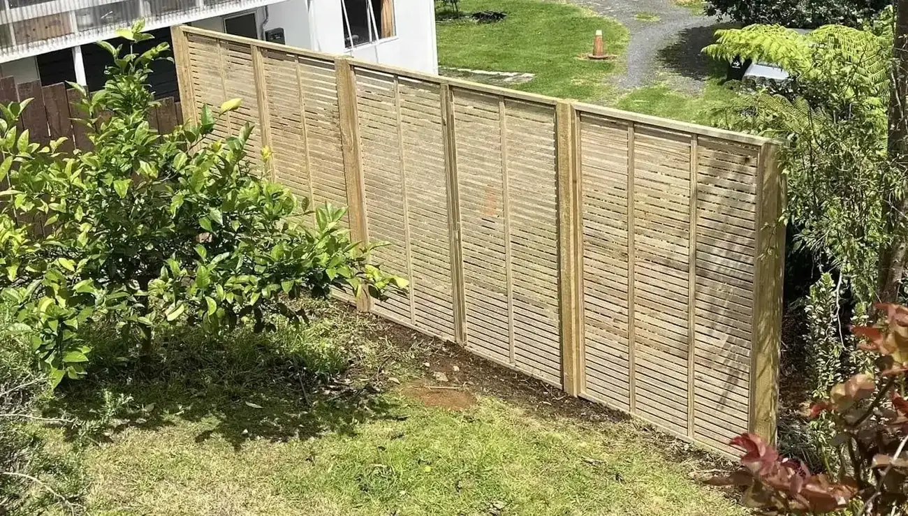 Timber trellis fence panels installed along a garden boundary