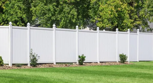 White PVC fence in a garden setting